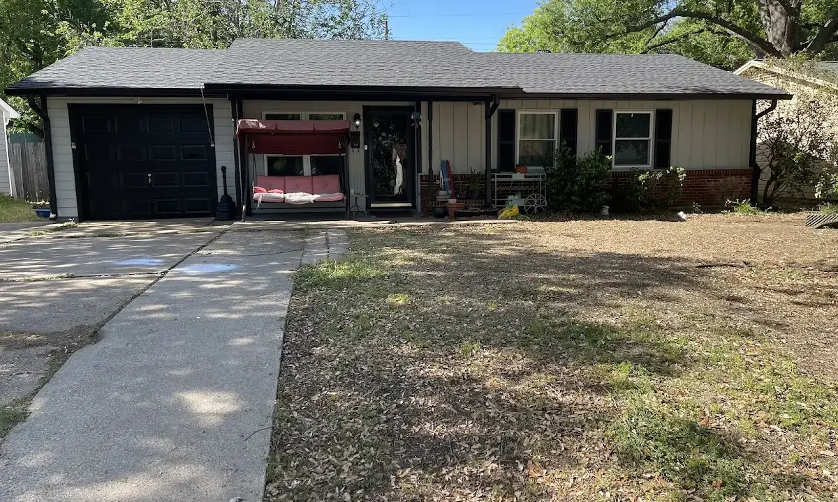 Asphalt Shingle Roof Repair crew at work on a residential roof in Chickasaw